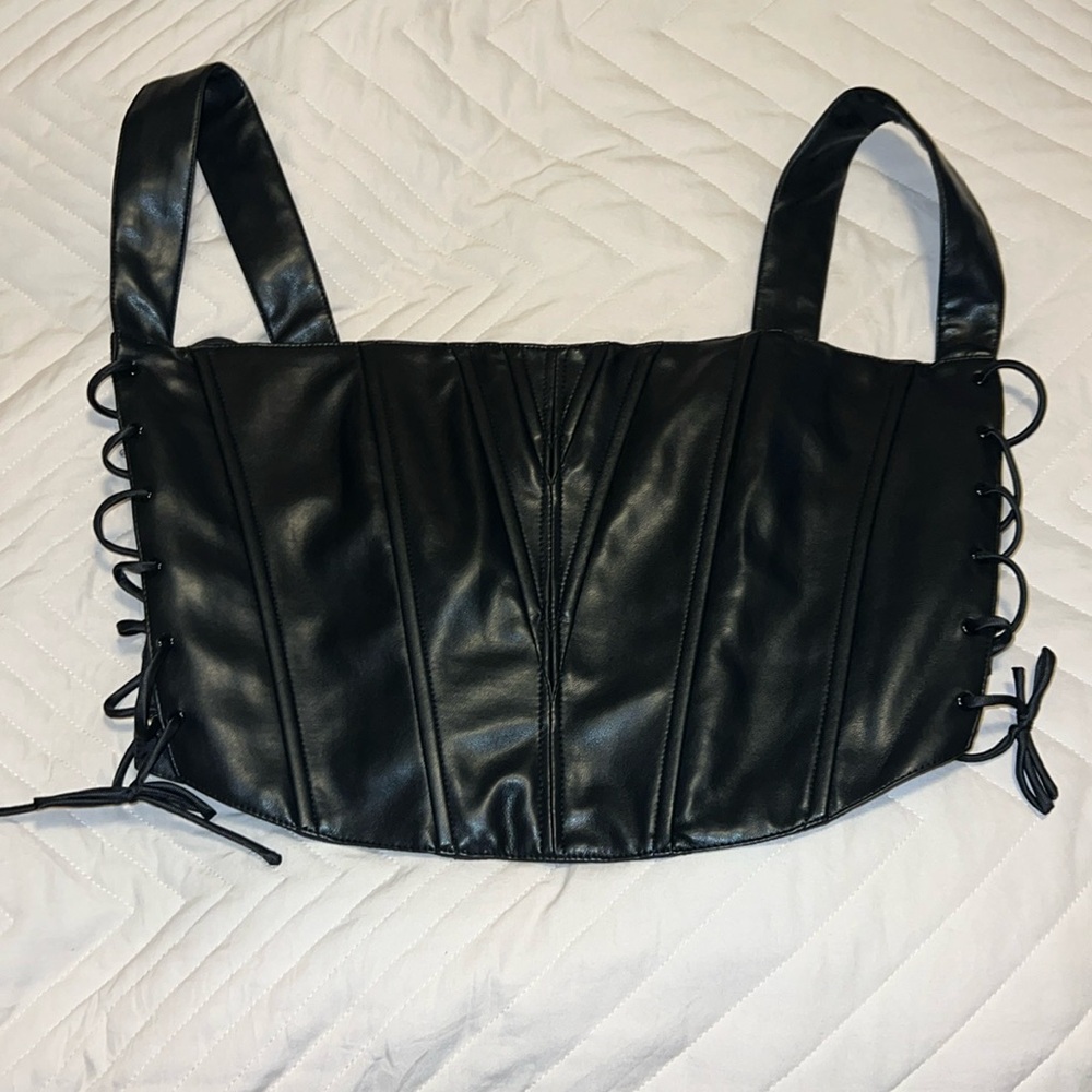 New with tags cute faux leather top.